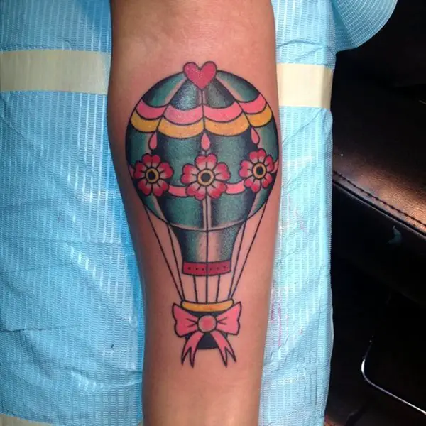 Color balloon tattoo on forearm for men