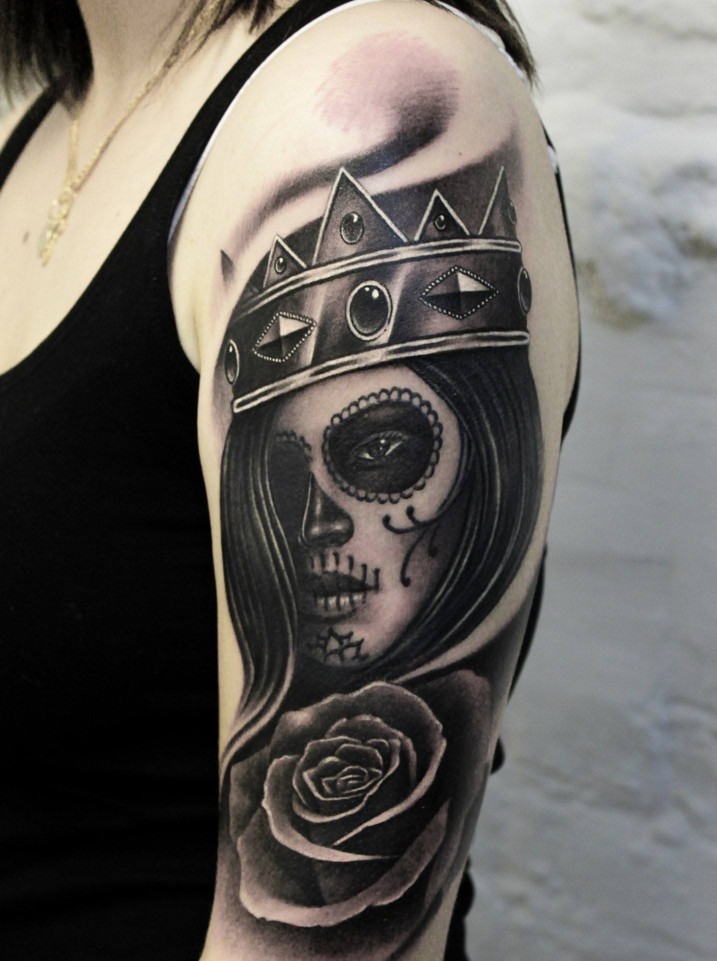 Chicano style tattoo on the shoulder for women