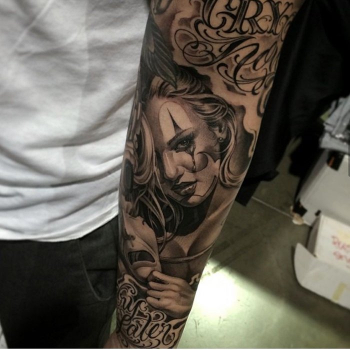 Chicano style tattoo on the arm for men