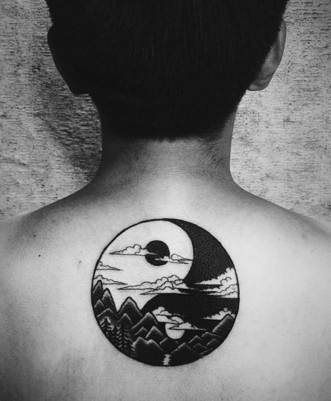 Large yin-yang tattoo on the back for men