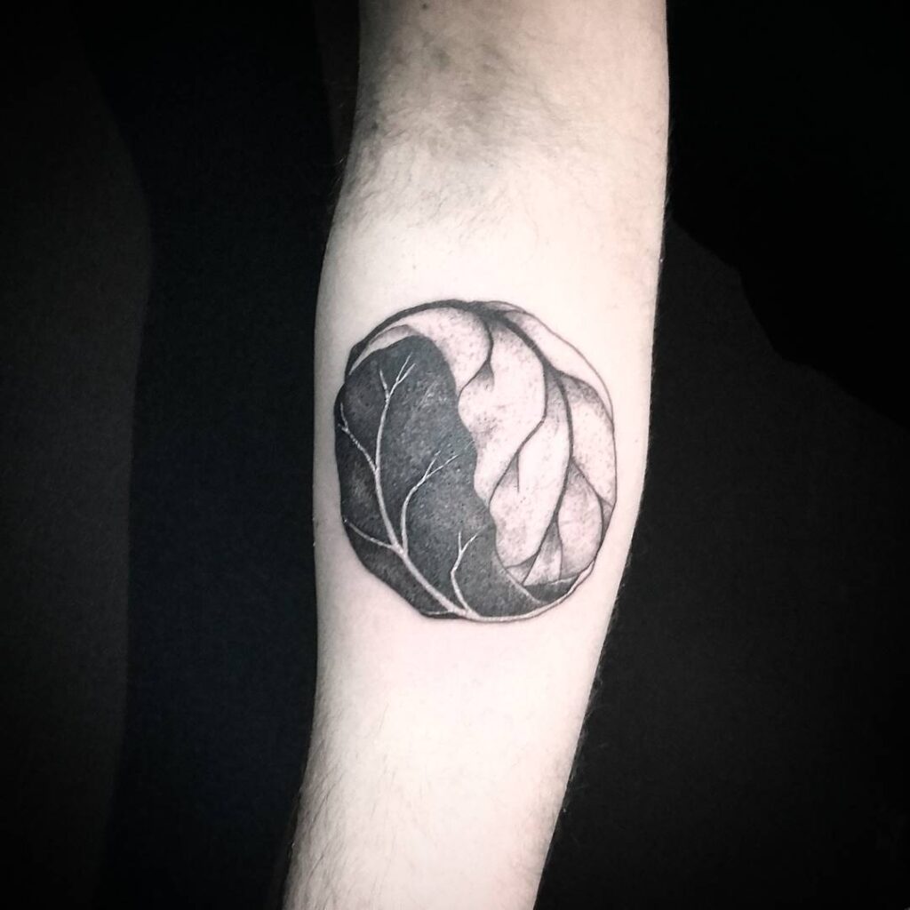 Yin-yang tattoo on forearm for men