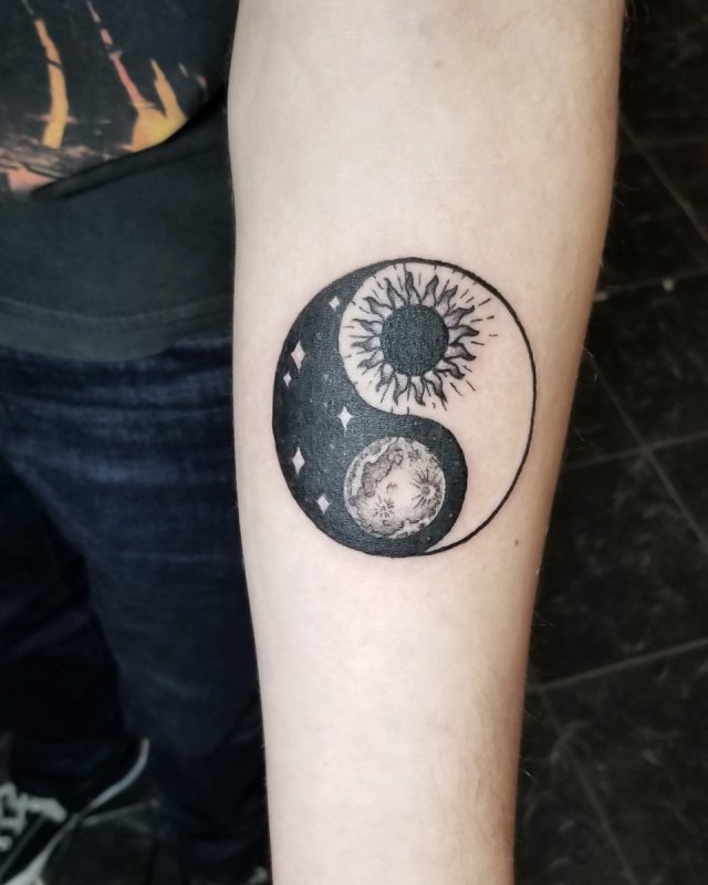 Yin-yang tattoo on forearm for men