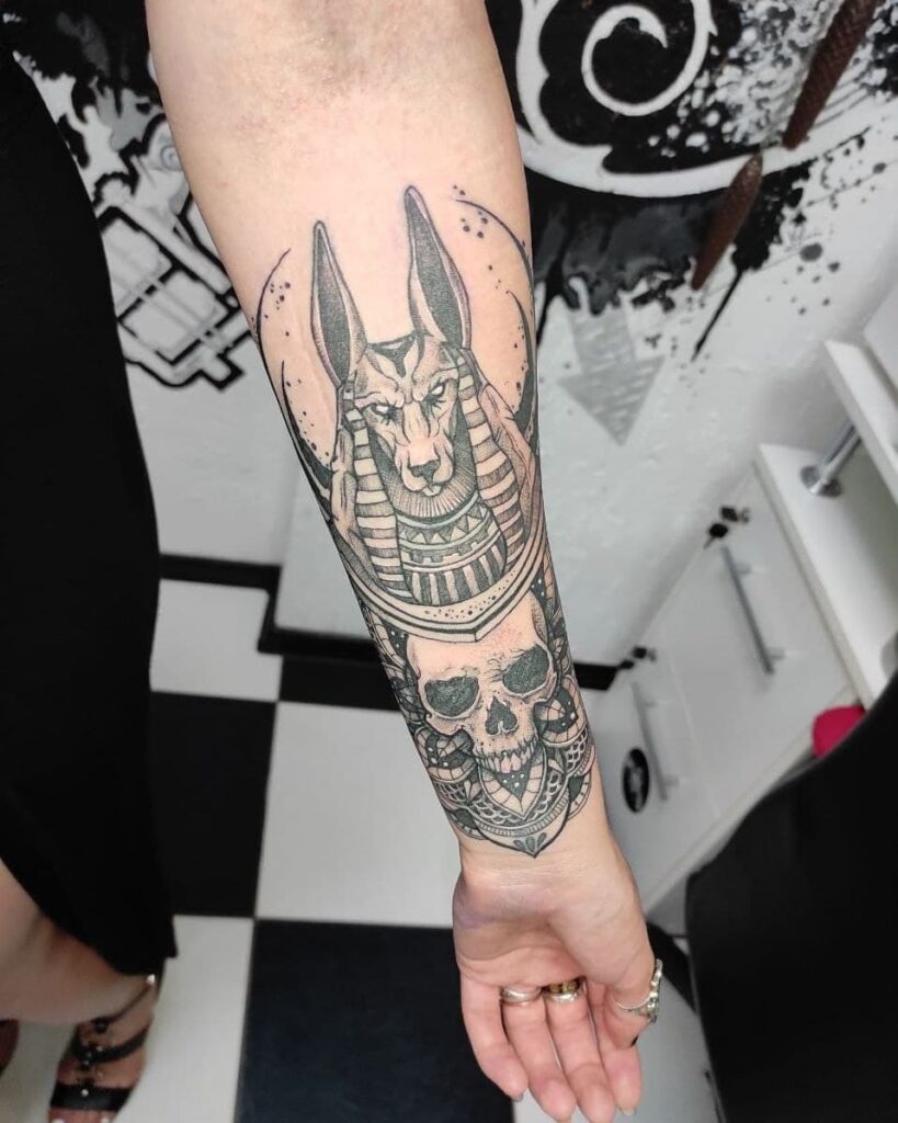 Anubis tattoo on forearm for women