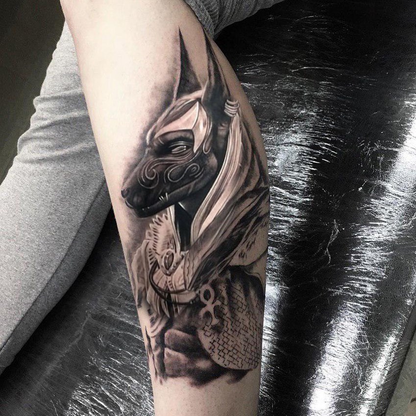 Anubis tattoo on the shin for men