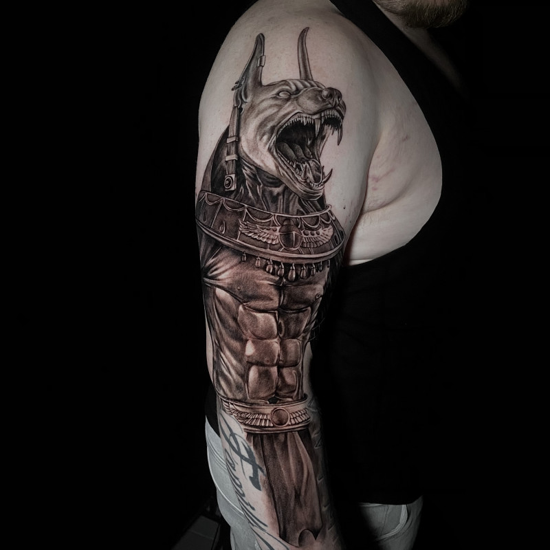 Anubis tattoo on the shoulder for men