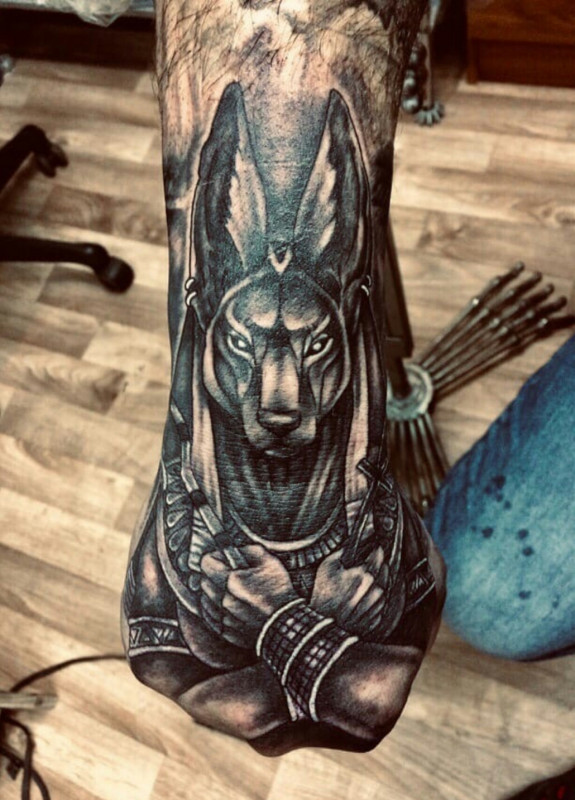 Anubis tattoo on the hand for men