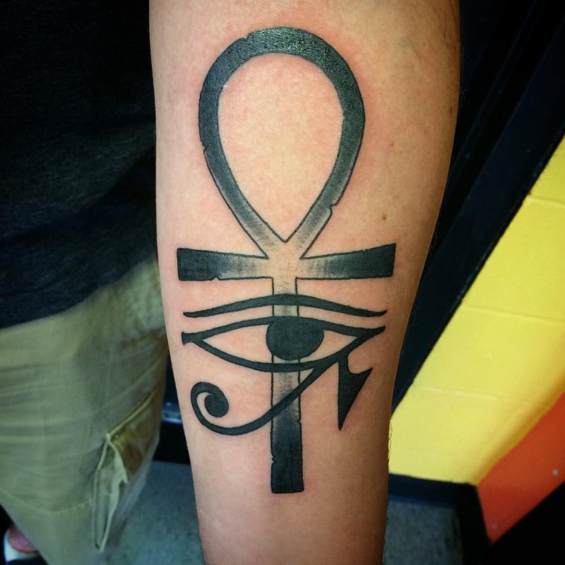 Ankh tattoo on the arm for men