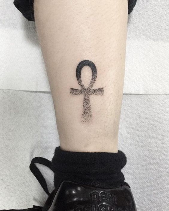 Ankh tattoo on the shin for men