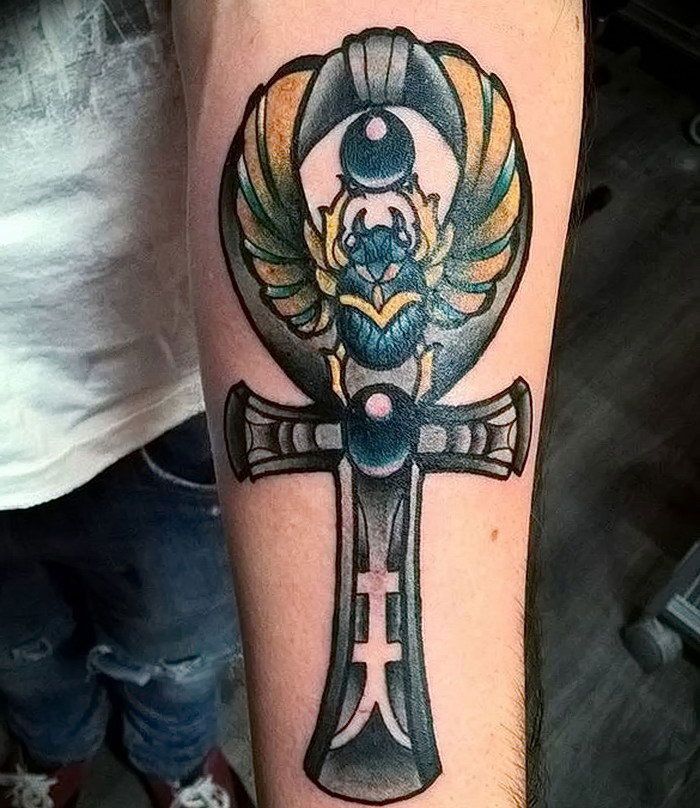 Colorful ankh tattoo on forearm for men