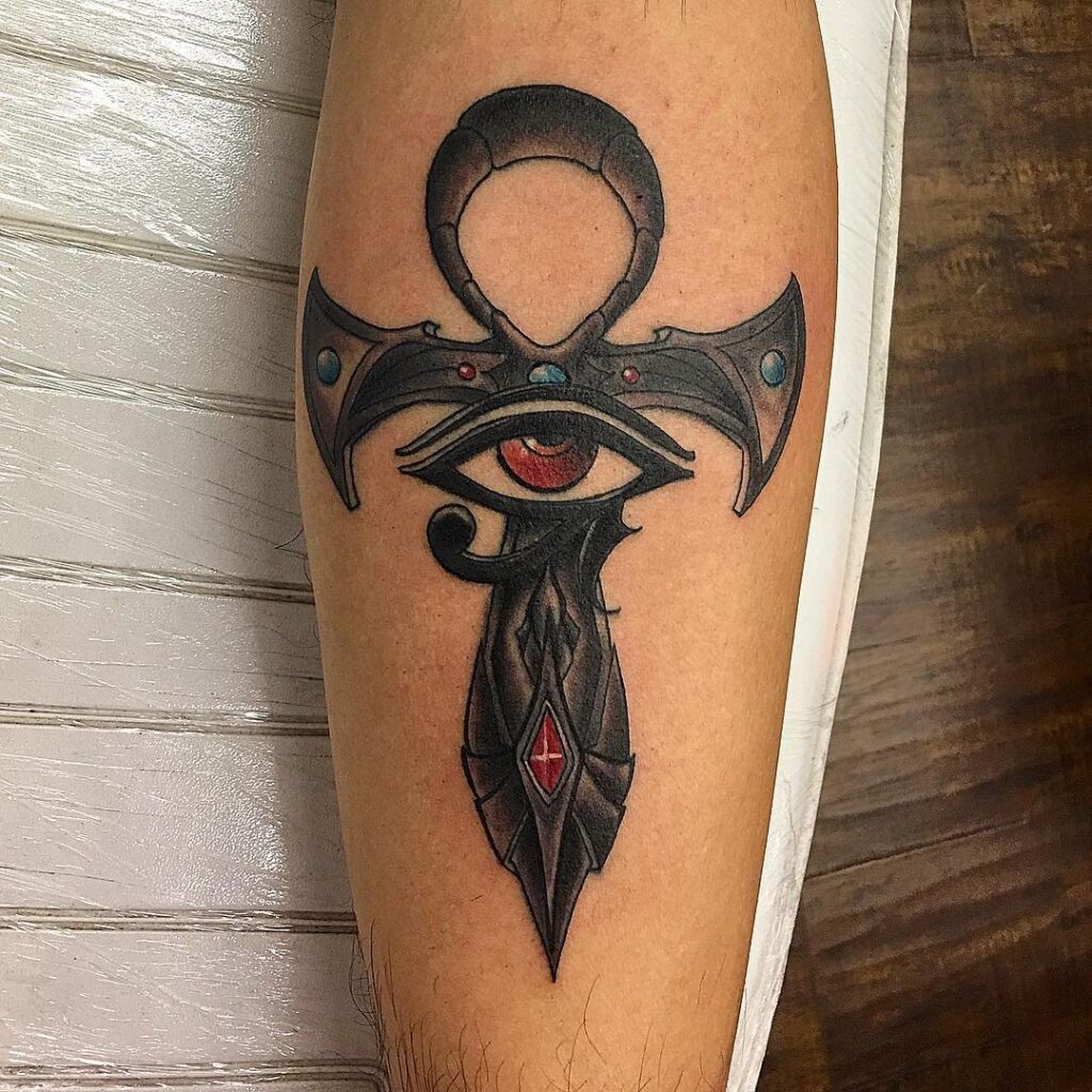 Colorful ankh tattoo on forearm for men