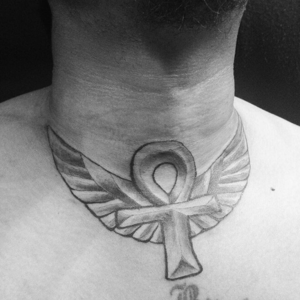 Ankh neck tattoo for men