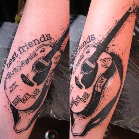 Guitar tattoo on the arm for men