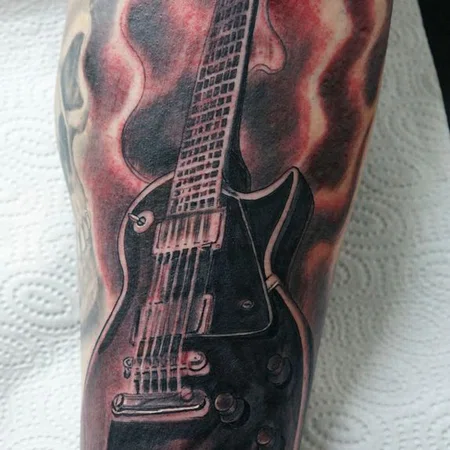 Guitar tattoo on leg for men