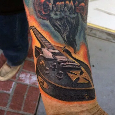 Colorful guitar tattoo on the arm for men