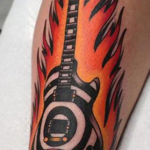 Colorful guitar tattoo on shin for men