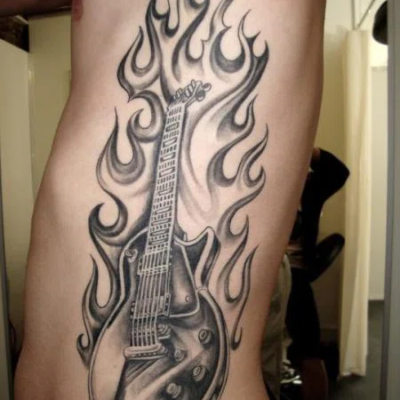 Guitar tattoo on the side for men