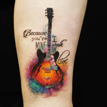 Colorful guitar tattoo on leg for men