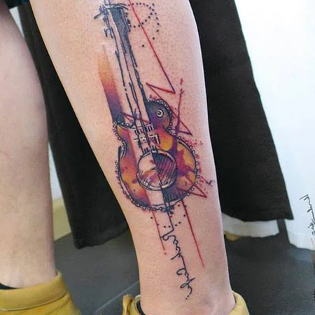 Guitar tattoo on shin for men