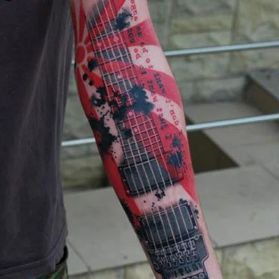 Guitar tattoo on the arm for men