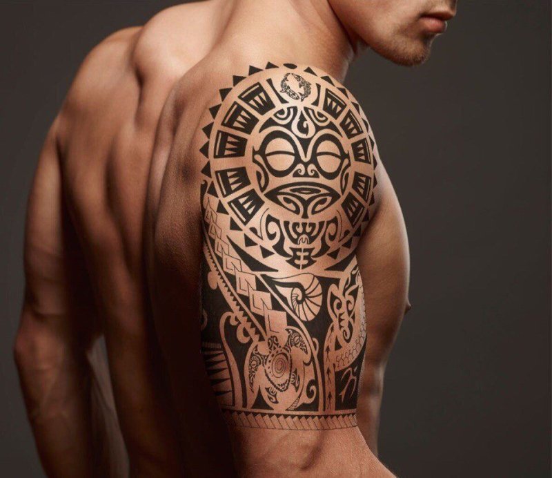 Polynesian style tattoo on the shoulder for men