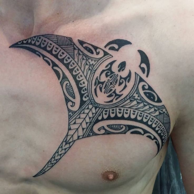 Polynesian style tattoo on the chest for men