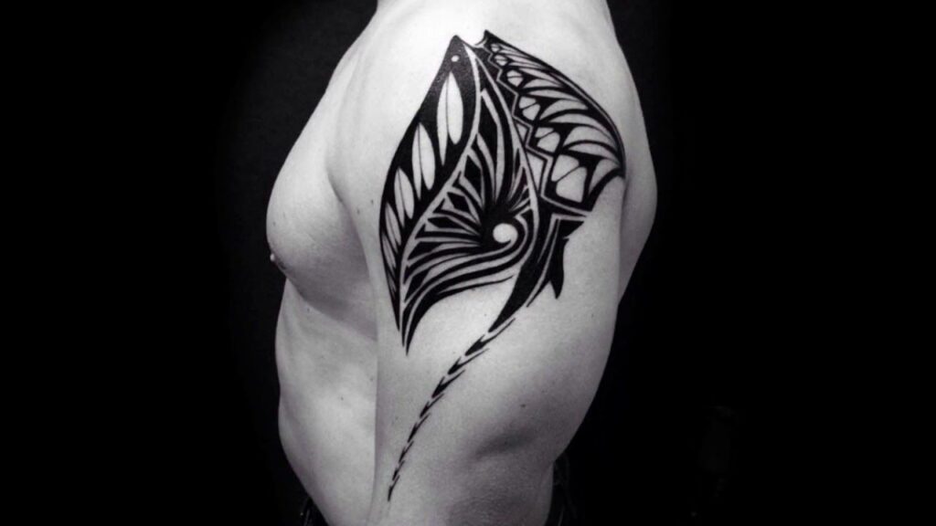 Polynesian style tattoo on the shoulder for men