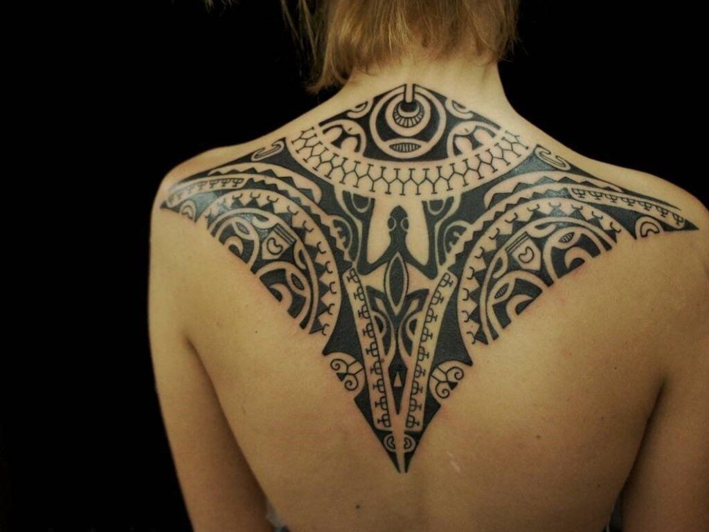 Polynesian style tattoo on the back for women