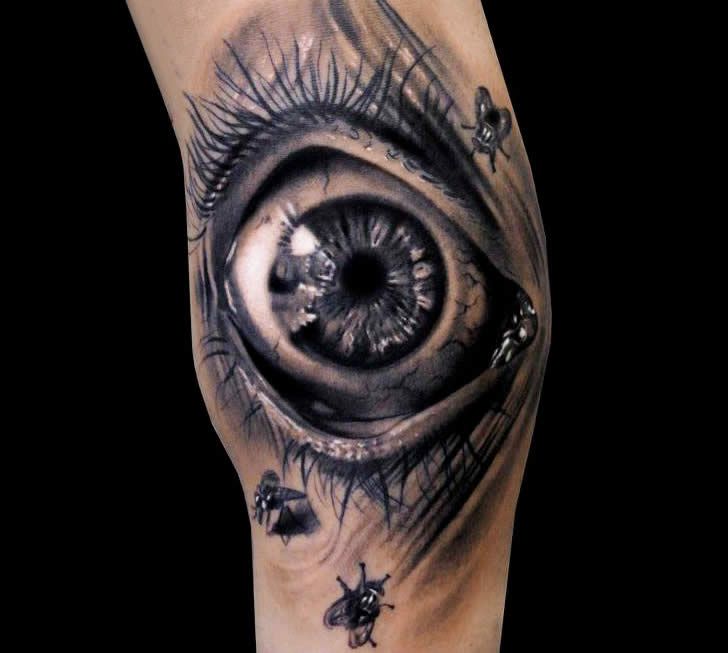 Eye tattoo on the calf for men