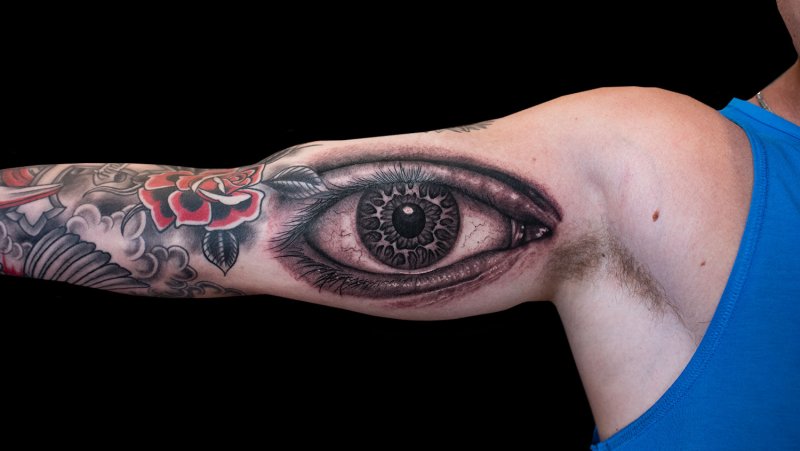 Eye tattoo on bicep for men