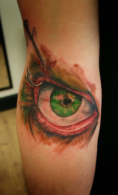 Colorful eye tattoo on arm for men