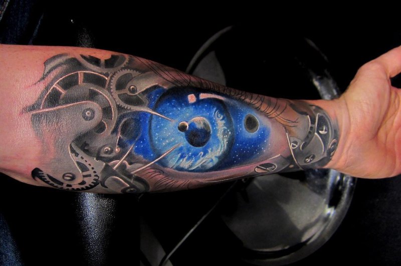 Large eye tattoo on the arm for men