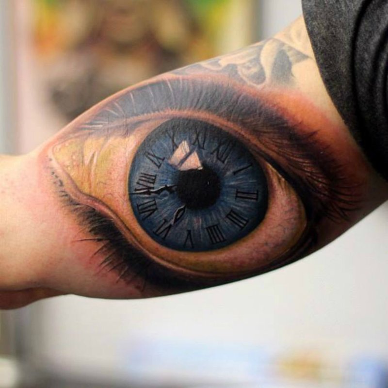 Eye tattoo on bicep for men