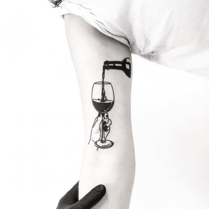 Wine tattoo on the shoulder for women