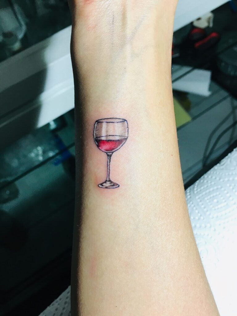 Wine tattoo on forearm for men