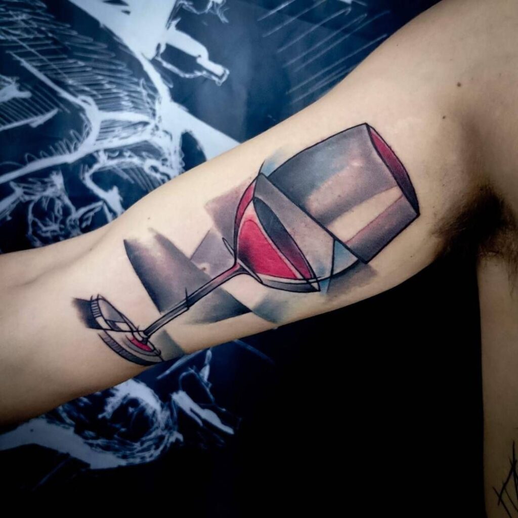 Large wine tattoo on the shoulder for men