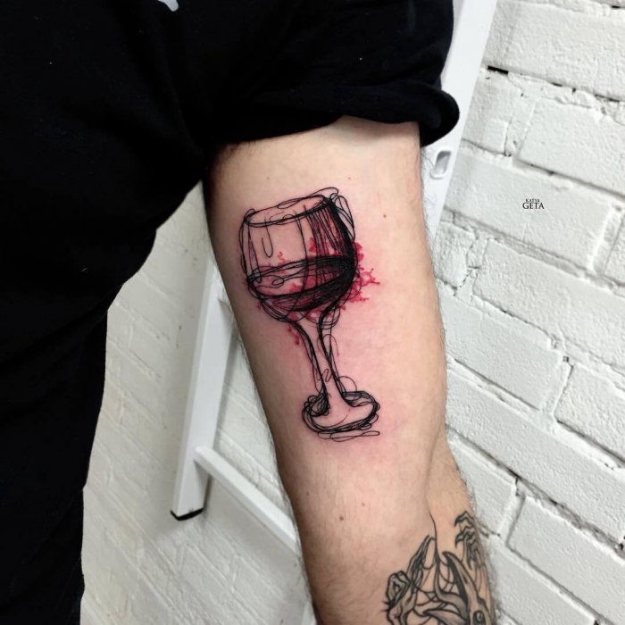 Colorful wine tattoo on shoulder for men