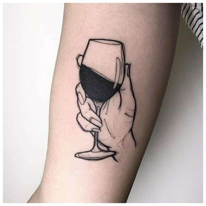 Wine and hand tattoo on the shoulder for men