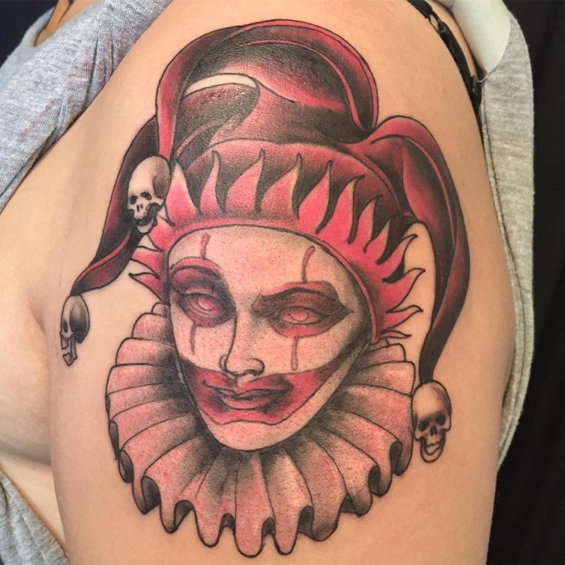 Harlequin tattoo on the shoulder for men