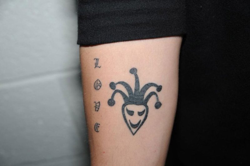 Harlequin tattoo on the shoulder for men