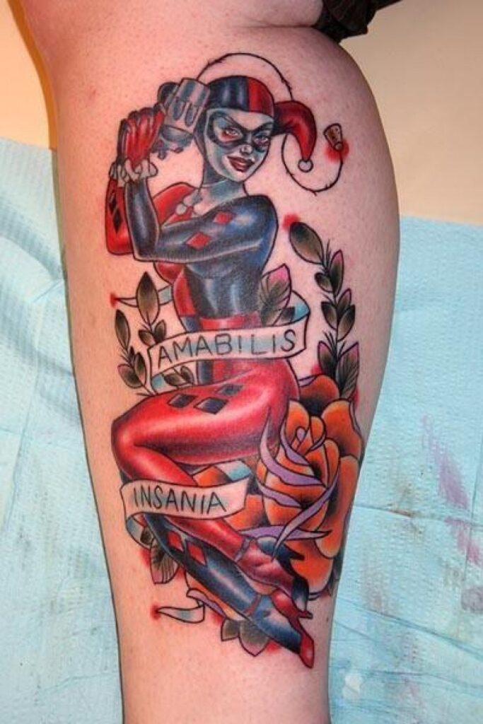 Harlequin color tattoo on shin for women