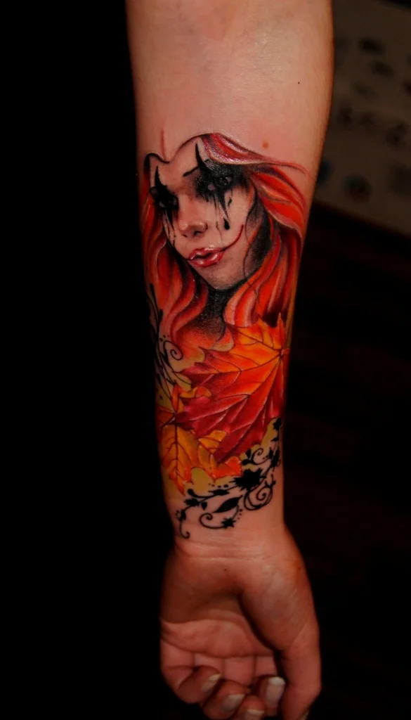 Harlequin tattoo on forearm for women