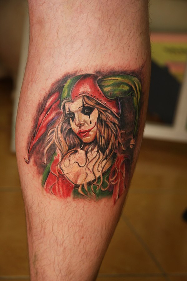 Harlequin tattoo on the calf for men