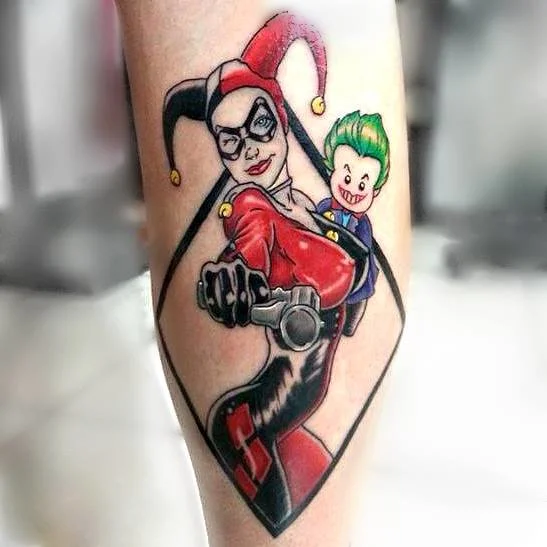 Harlequin tattoo on the shin for women