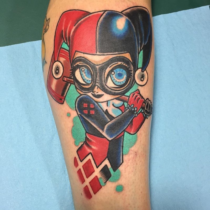 Harlequin tattoo on forearm for men