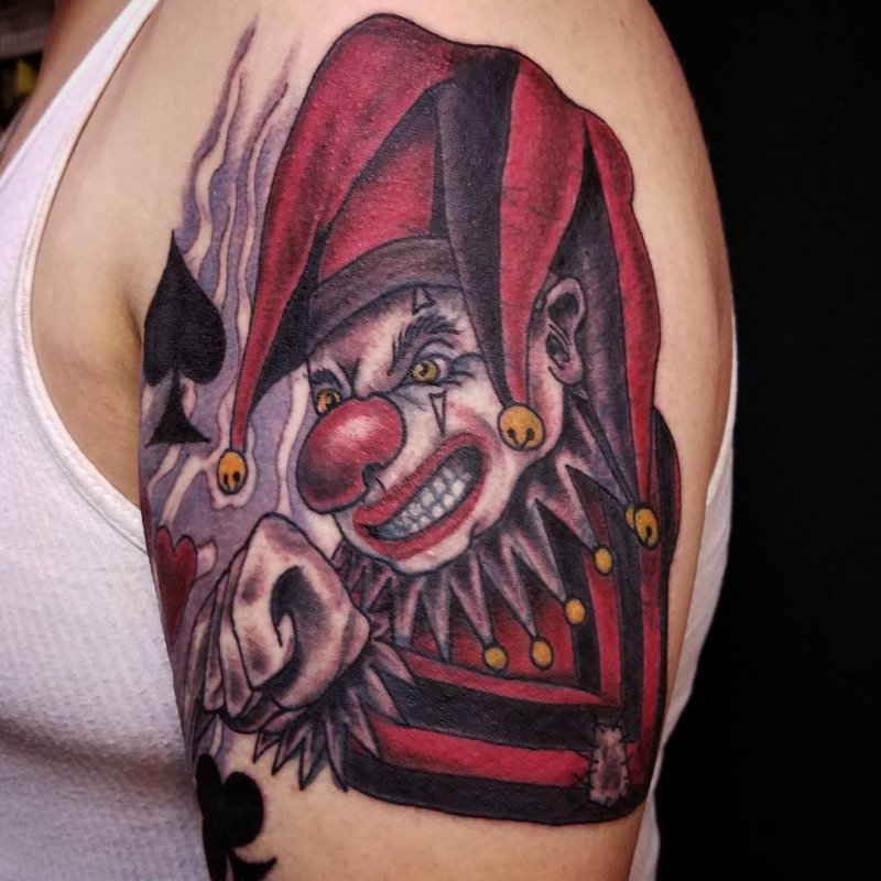 Harlequin tattoo on the shoulder for men