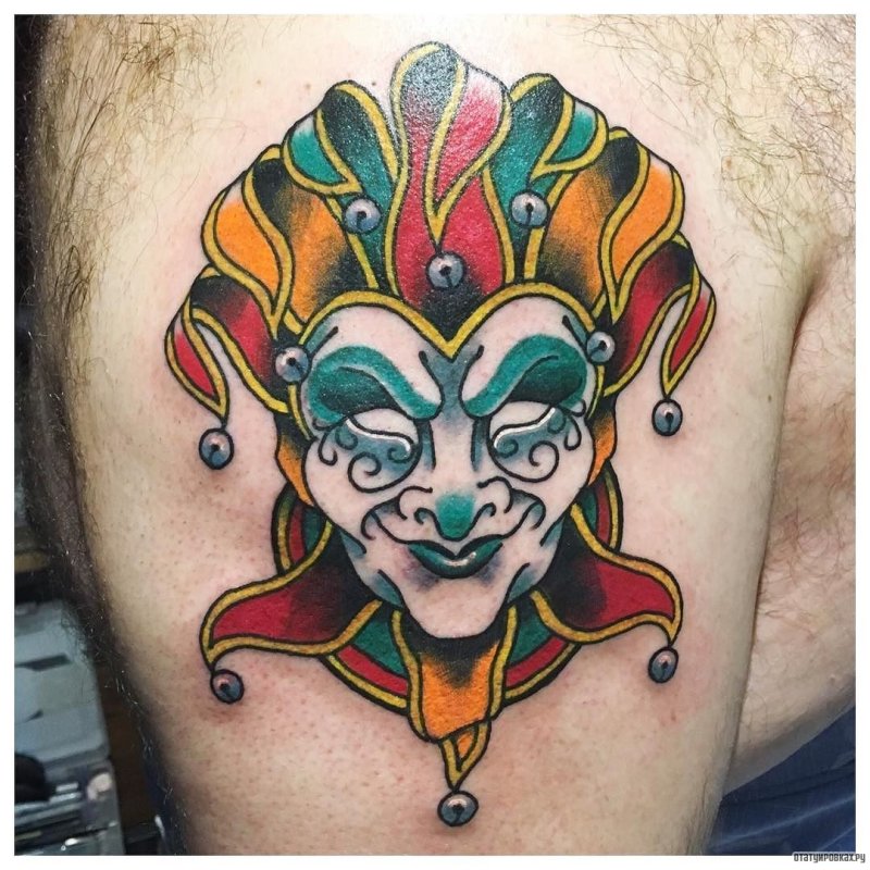 Large harlequin tattoo on the shoulder for men