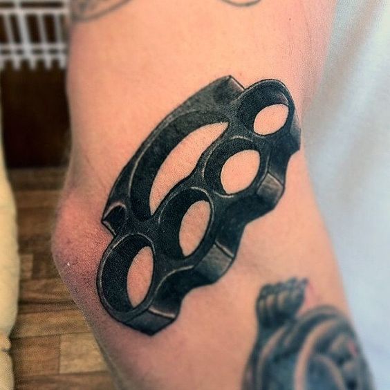 Knee knuckle tattoo for men