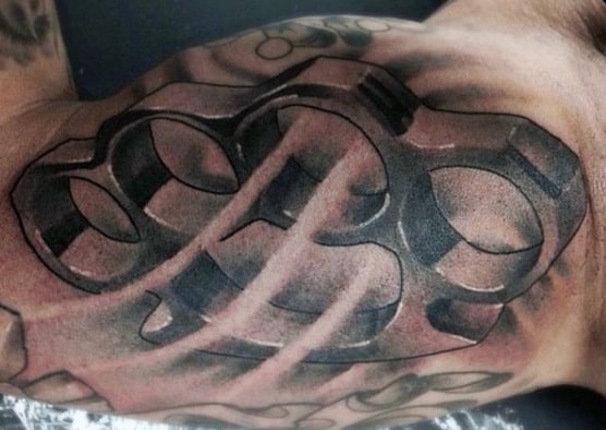 Knuckles tattoo on the arm for men