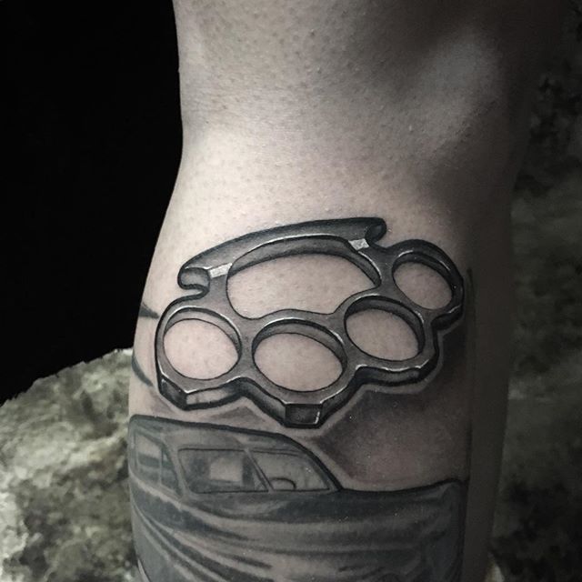 Knuckles tattoo on the shin for men