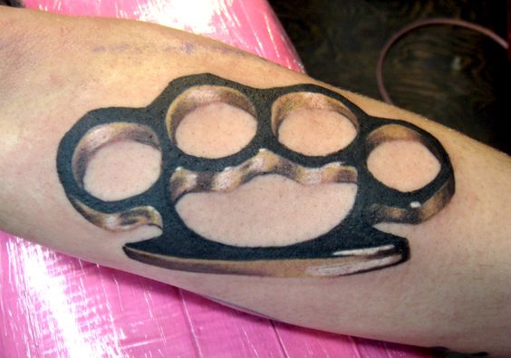 Knuckles tattoo on the arm for men